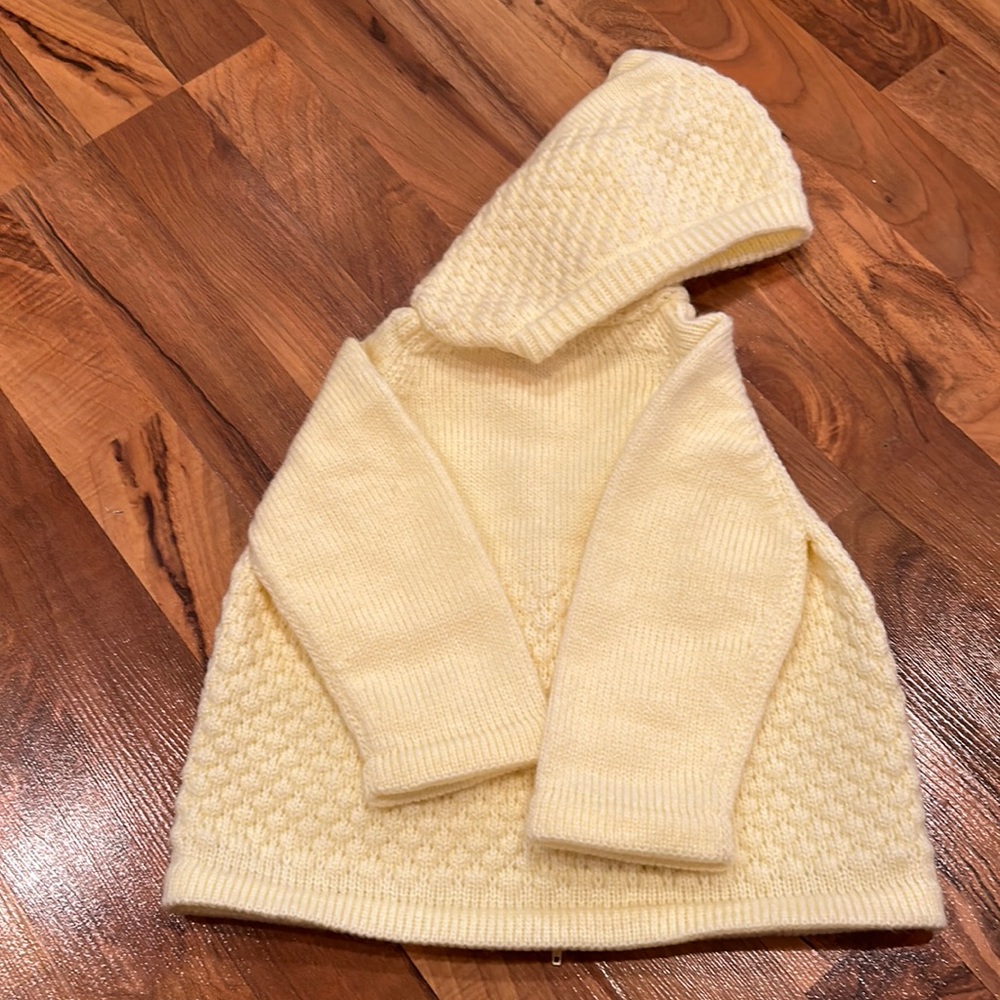 Handmaid yellow knit sweater, functioning zipper detail‎ up back of sweater.